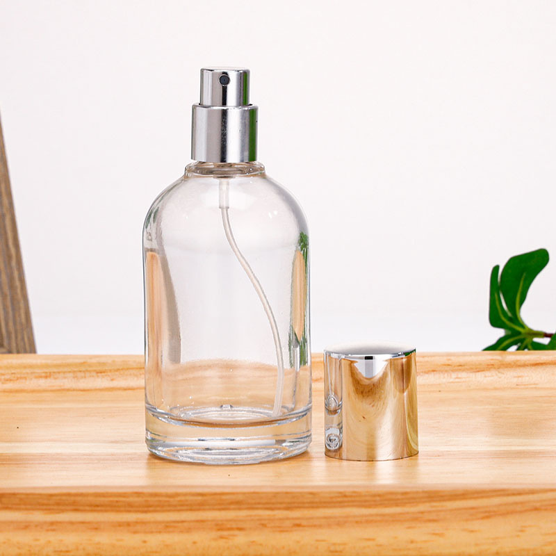 Best-Selling 100ml Minimalist Style Transparent Curly Perfume Spray Glass Bottle with Silver Cap